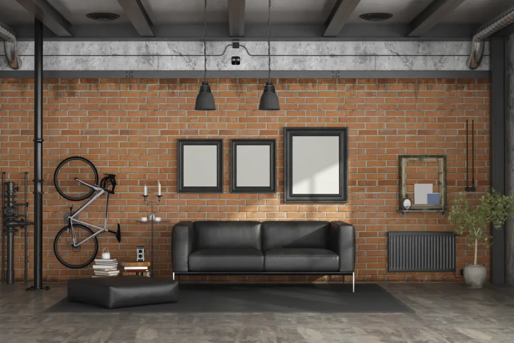 Industrial style living room with exposed brick wall, black leather sofa, hanging bike, and modern decor