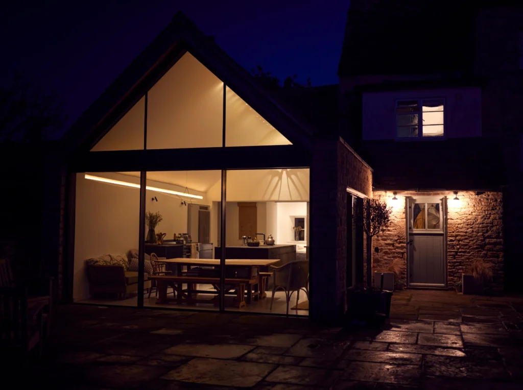 Photo of a single-storey rear extensions in south wales Bridgend image taken at night with moody lighting.